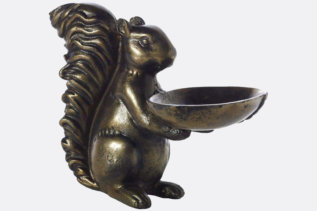 Squirrel holding a bowl table sculpture