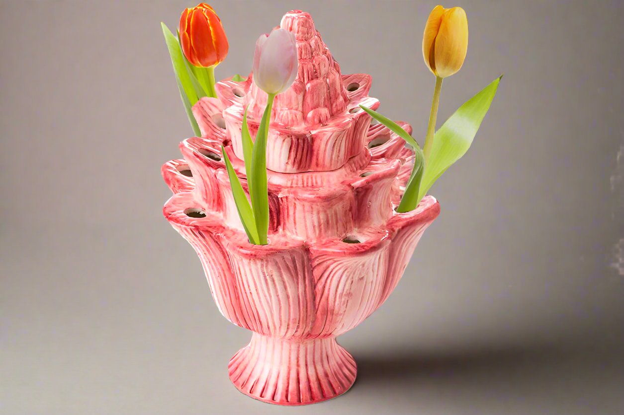 Tulip display vase made from ceramic with pink glaze, shown with tulips