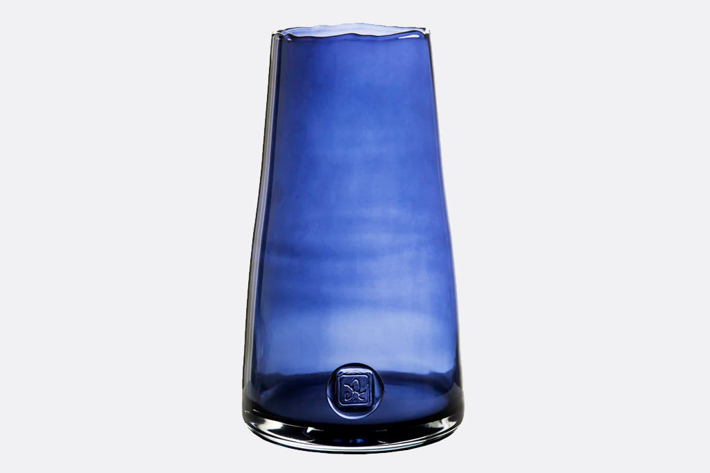 deeply saturated glass vase in rich blues; heavy glass with makers mark impression, wavy rim - reminescent of ocean waves