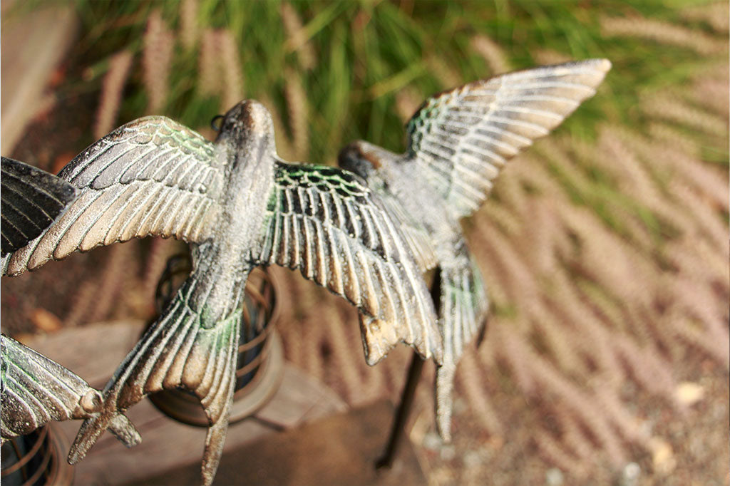 close up of sculpted wing of swallow lantern